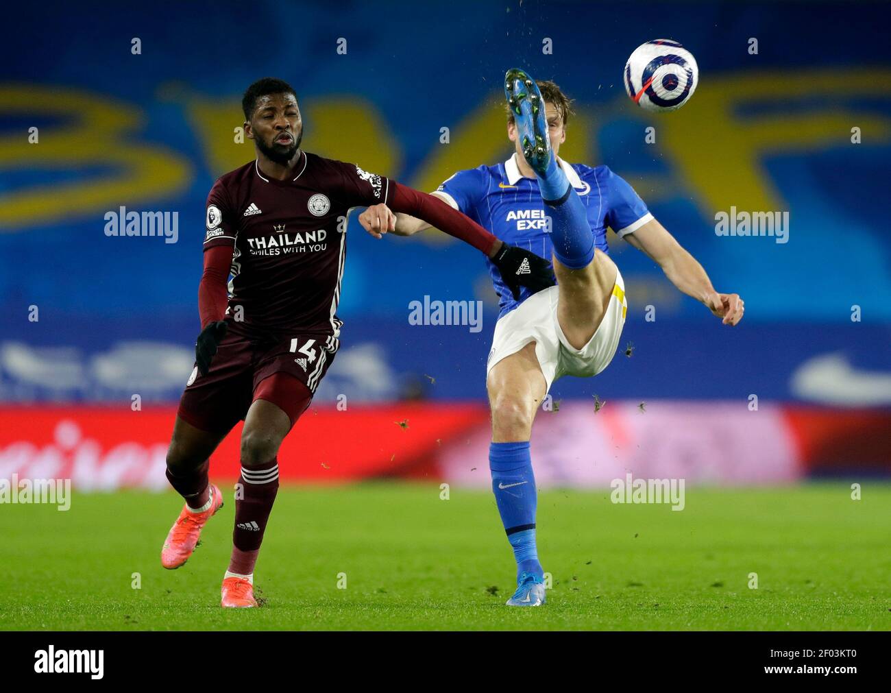 Leicester City's Kelechi Iheanacho (left) and Brighton and Hove Albion's Dan Burn during the Premier League match at the American Express Community Stadium, Brighton. Picture date: Saturday March 6, 2021. Stock Photo