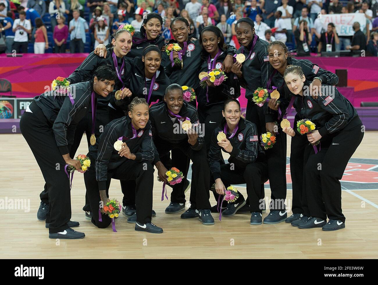 The Usa Basketball Team Poses For Photos After The Gold Medal Presentation Ceremony Following Their Victory Over France At The North Greenwich Arena During The 12 Summer Olympic Games In London England