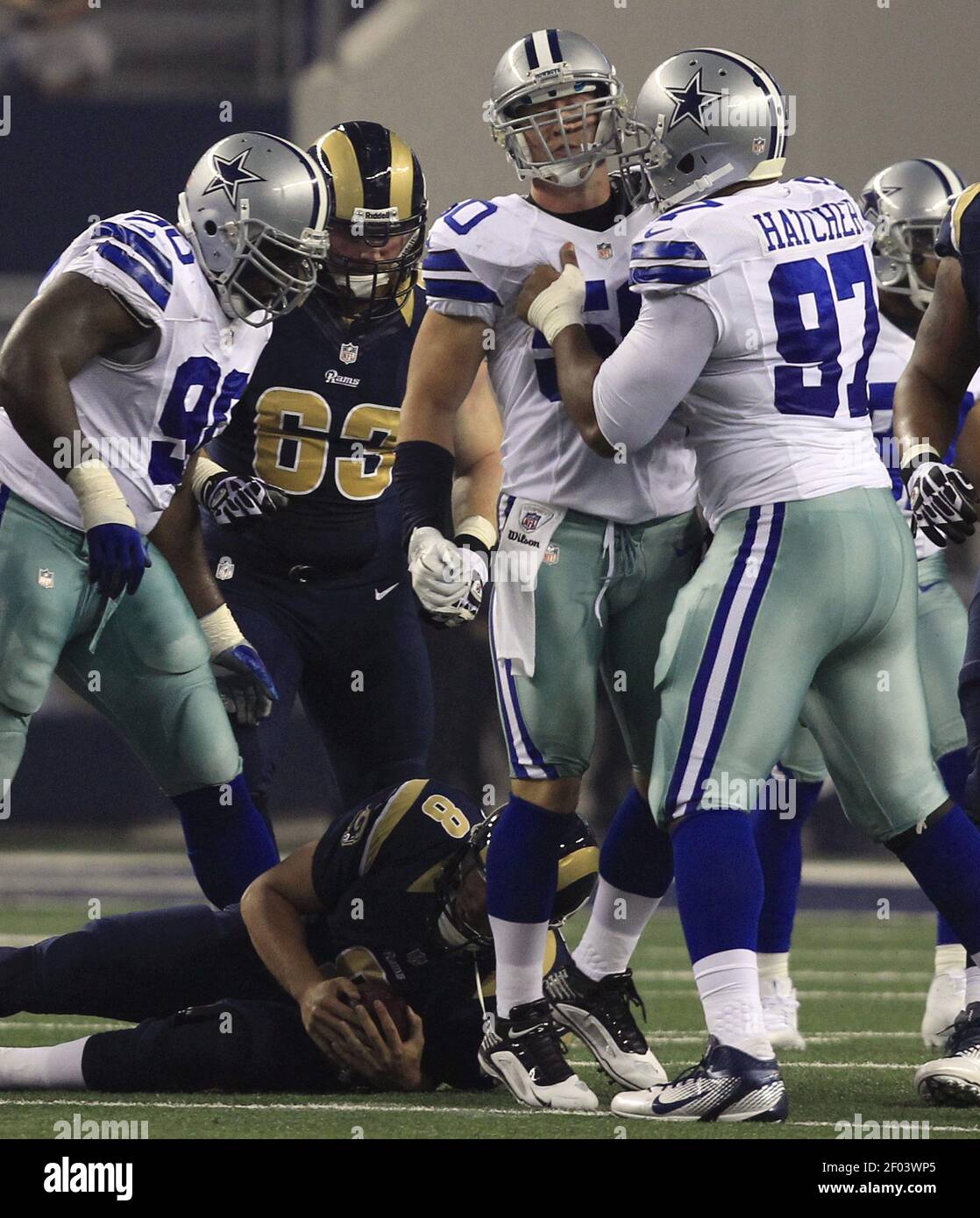 Dallas Cowboys linebacker Sean Lee (50) and defensive tackle Josh Brent  (92) celebrate after Lee sacked St. Louis Rams quarterback Austin Davis (9)  during pre-season action at Cowboys Stadium in Arlington, Texas