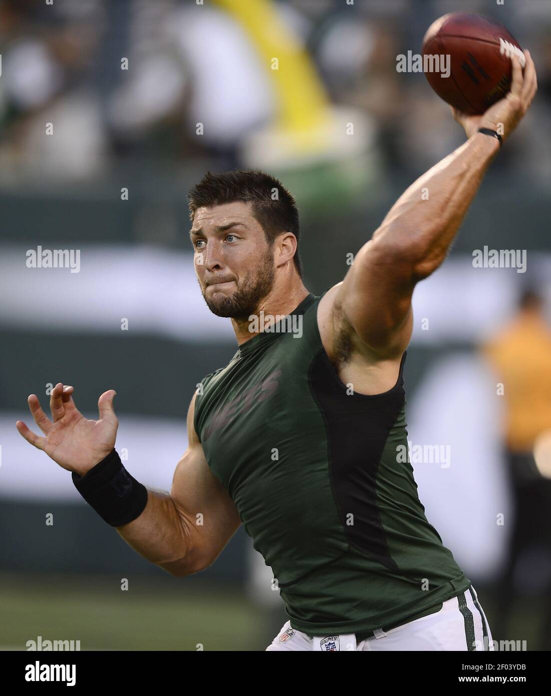 New York Jets quarterback Tim Tebow (15) passes during pregame drills