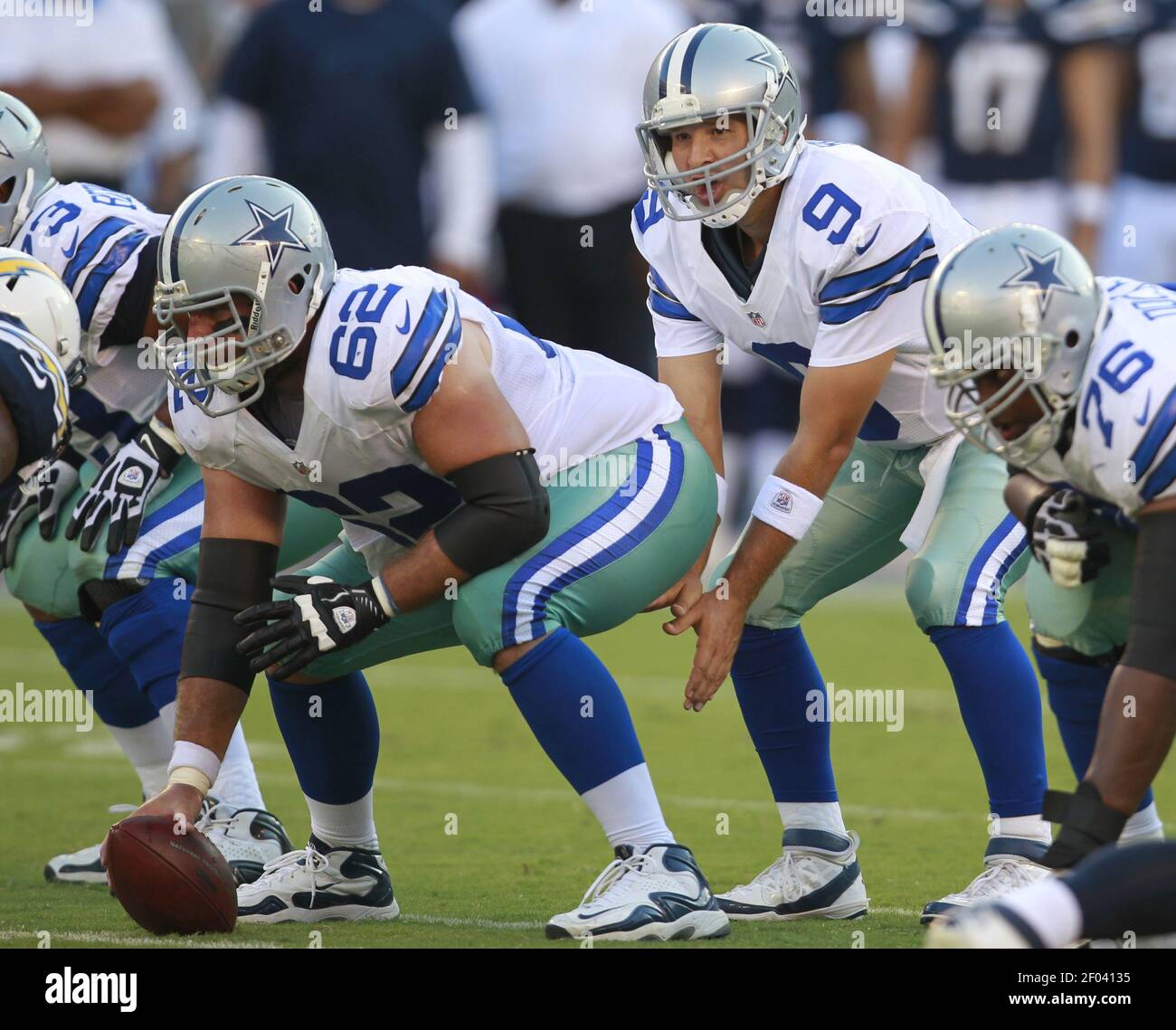 Dallas Cowboys quarterback Tony Romo (9) prepares to take the snap from  center David Arkin (62) against the San Diego Chargers in NFL preseason  action at Qualcomm Stadium in San Diego, California,