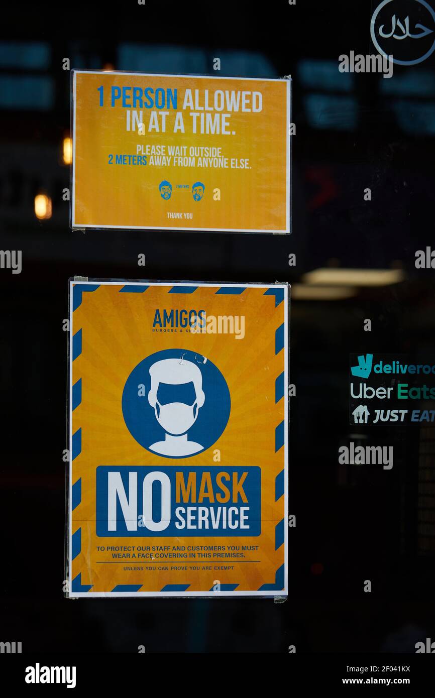 London, UK - 26 Feb 2021: London, UK - A 'No Mask No Service' sign on a London restaurant during the coronavirus pandemic. Concerns have been raised about the impact of  such notices on those medically exempt. Stock Photo