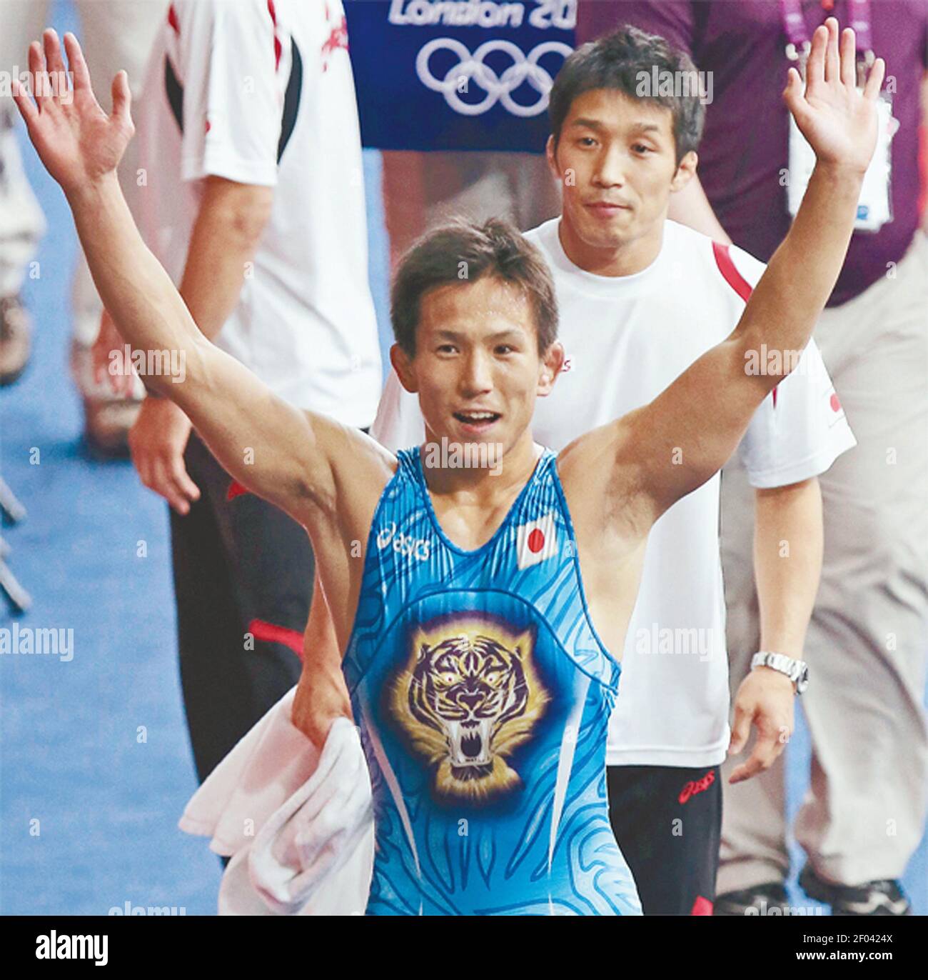 Japan's Shinichi Yumoto reacts to taking a bronze medal in the men's 55
