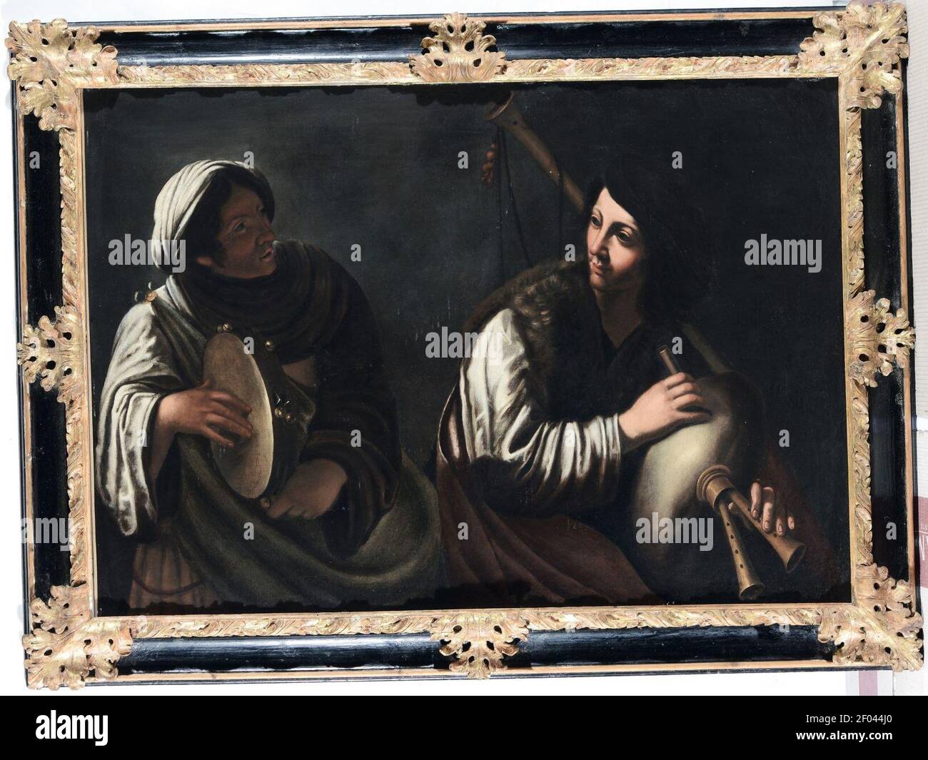 Pietro Paolini - Woman playing a tambourine and woman playing a bagpipe. Stock Photo