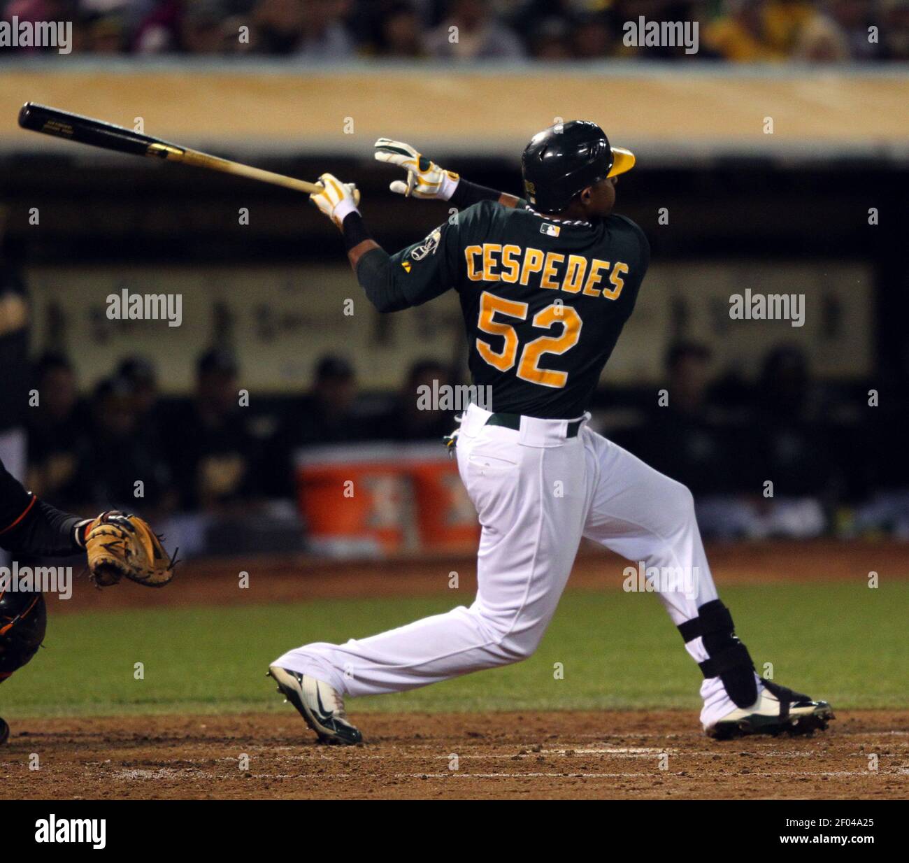 Oakland Athletics' Yoenis Cespedes, right, celebrates his solo home run  with teammate Josh Reddick (16) during the fourth inning of the second game  of a doubleheader baseball game against the Seattle Mariners