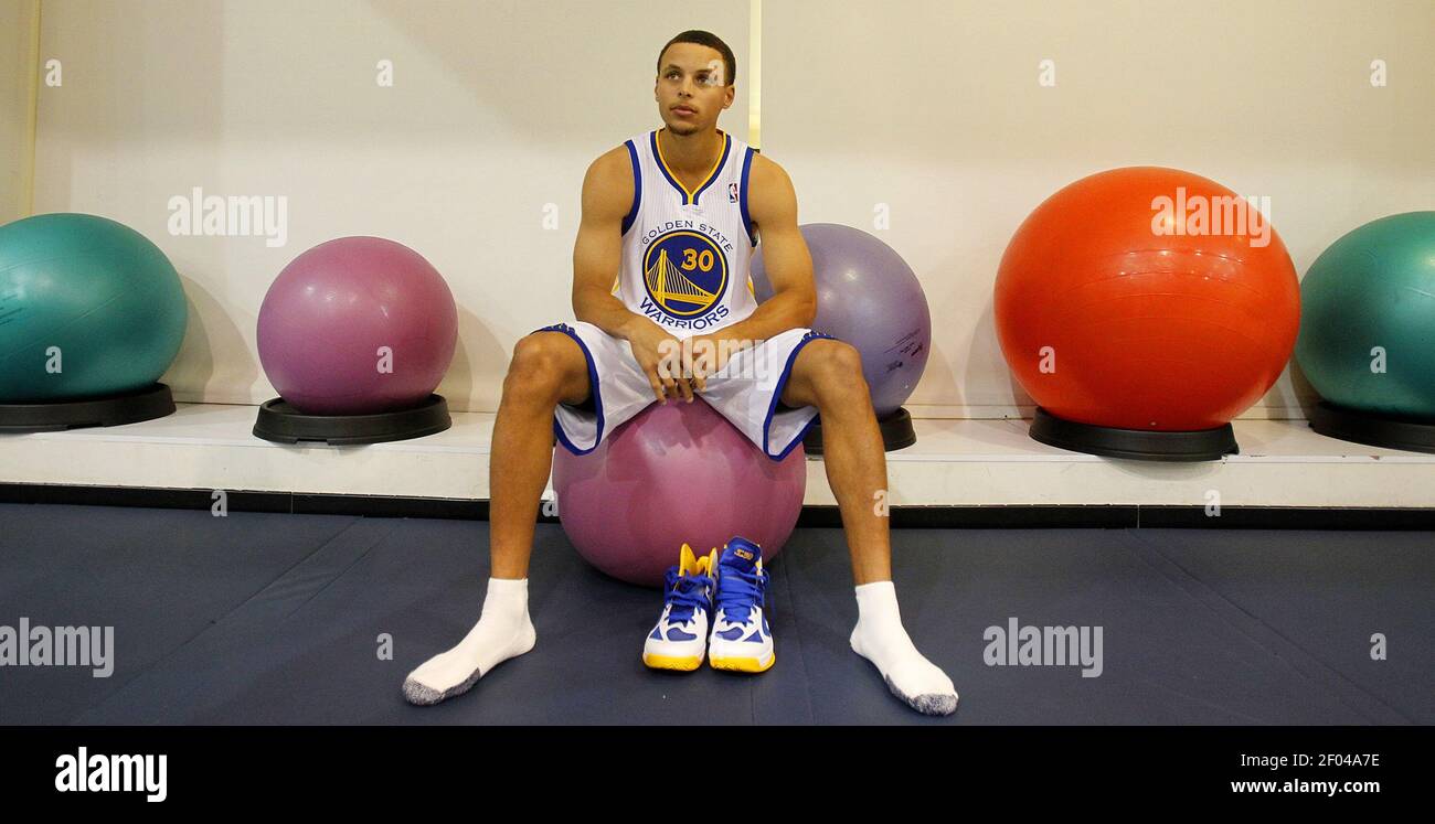 Golden State Warriors guard Stephen Curry sits on an exercise ball ...