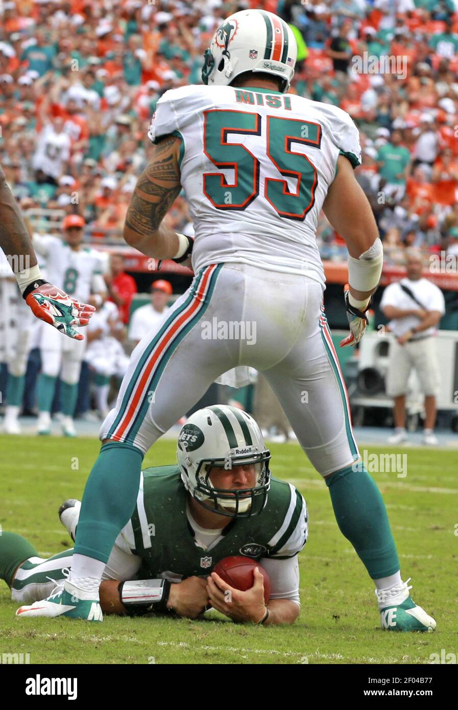 New York Jets Tim Tebow and Mark Sanchez warm up on the field before the  game against the New York Giants in a Pre Season NFL game at MetLife  Stadium in East