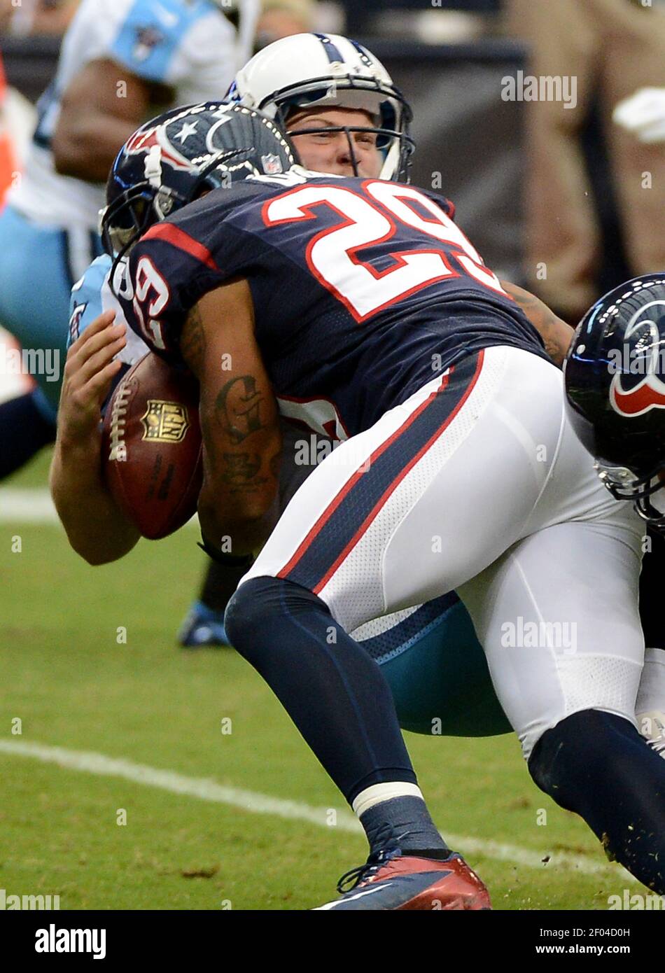 Jake Locker (10) of the Tennessee Titans is sacked by Glover Quin (29 ...