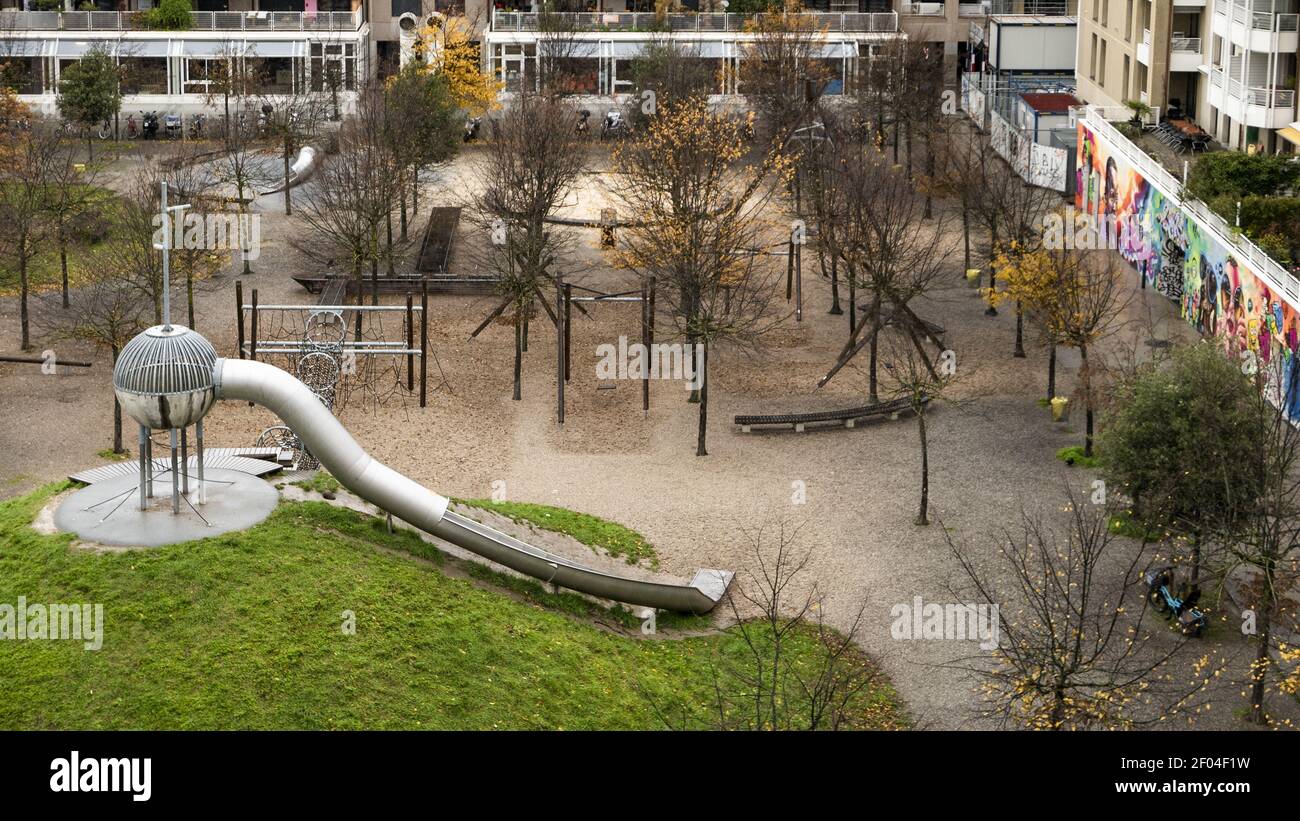 GENEVA, SWITZERLAND - Nov 29, 2019: Metal toboggan and children playground in a park Stock Photo