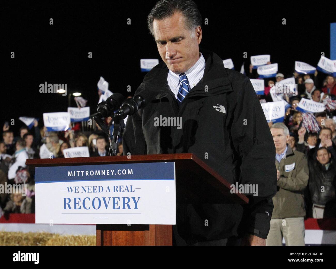 Republican presidential candidate Governor Mitt Romney pauses as the ...