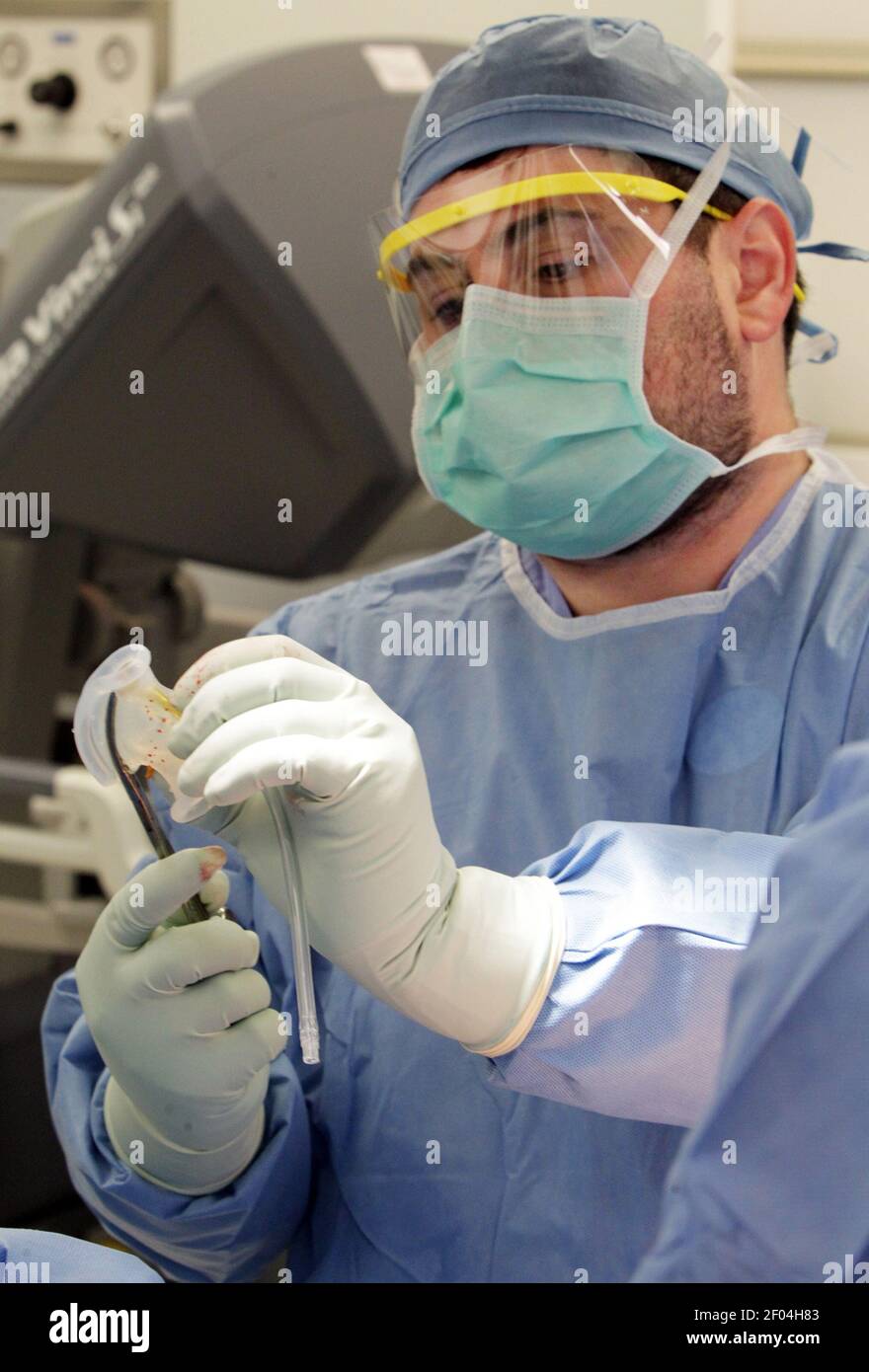Dr. Adrian G. Dan, an advanced laparoscopic surgeon, readies the