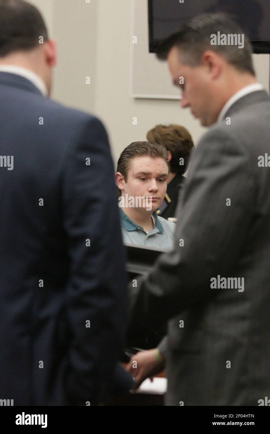 Brogan Rafferty looks on as the prosecution and defense read over ...