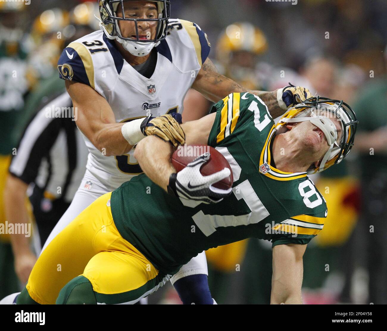 Green Bay Packers 'Jordy Nelson (87) is pulled down by his facemask by St.  Louis Rams' Cortland Finnegan (31) resulting in a penalty and first down on  Sunday, October 21, 2012 at