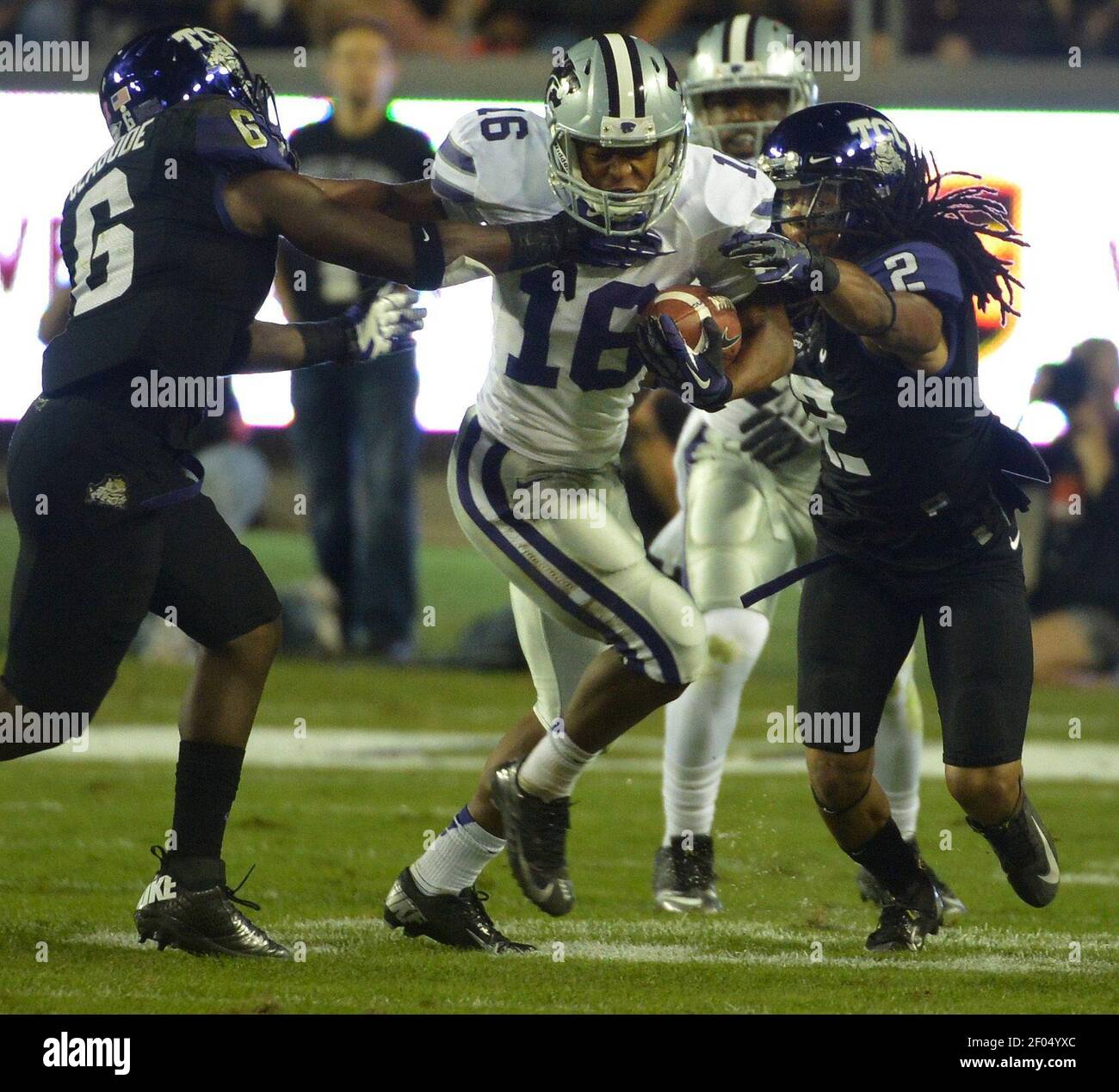 Kansas State Wide Receiver Tyler Lockett 16 Picks Up A First Down During The First Half In Front Of Texas Christian Defenders Elisha Olabode 6 And Jason Verrett 2 At Amon G