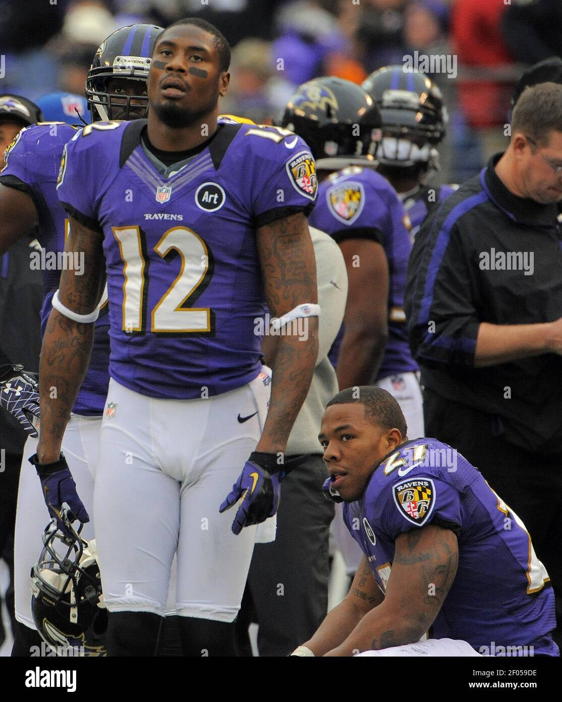 The Baltimore Ravens' Jacoby Jones (12) and running back Ray Rice appear  deflated on the sidelines after an interception by quarterback Joe Flacco  in the second quarter against the Denver Broncos at