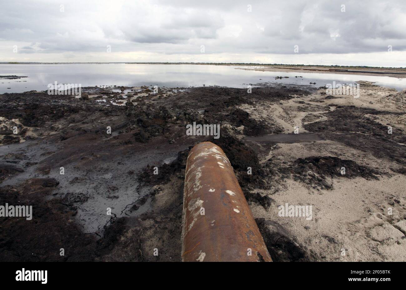 A pipe that carries sand dredged from the Mississippi River lays on a