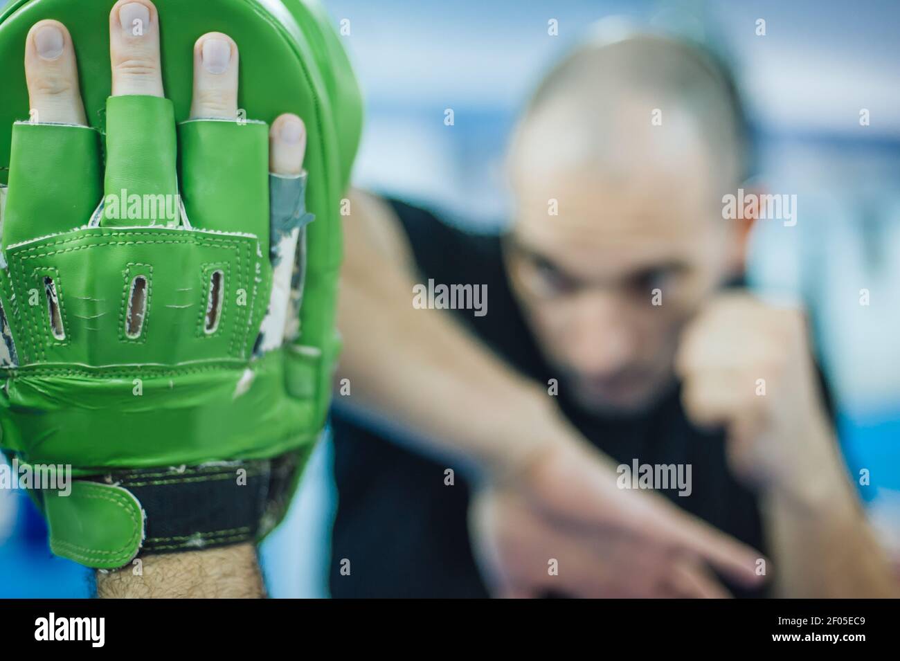 Elbow kick technique training with focus mitts. Elbow strike and punch