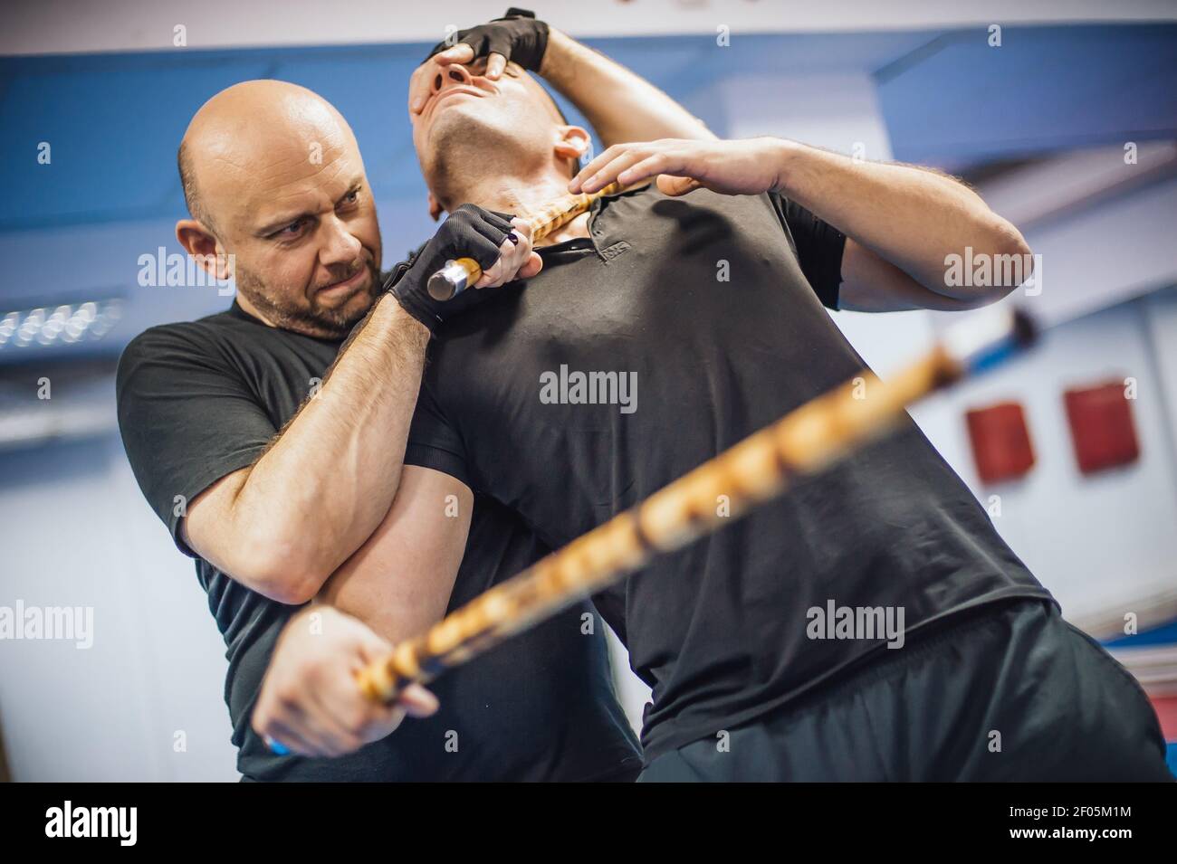 Escrima and kapap instructor demonstrates sticks fighting