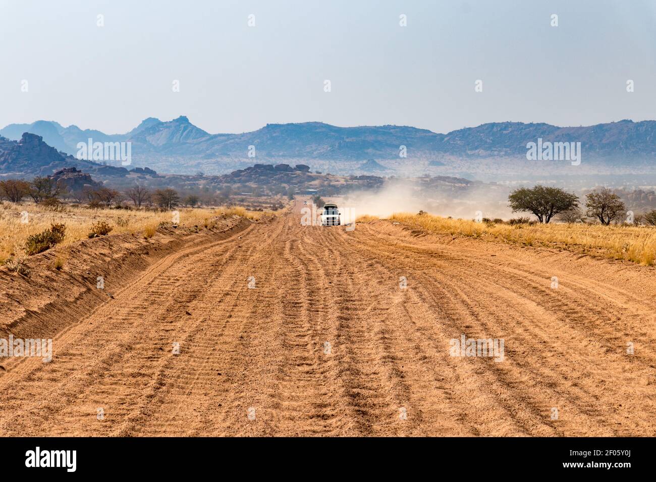 Washboard gravel road in Namibia cars giving big dust clouds