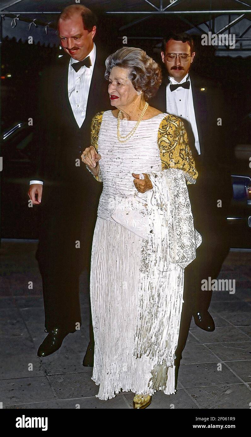 Houston Texas, USA, October 19, 1991 Former First Lady Lady Bird Johnson wife of former President Lyndon B. Johnson arrives with her secret service escorts at benefit gala fundraiser for the University of Texas M.D. Anderson Cancer Center Stock Photo