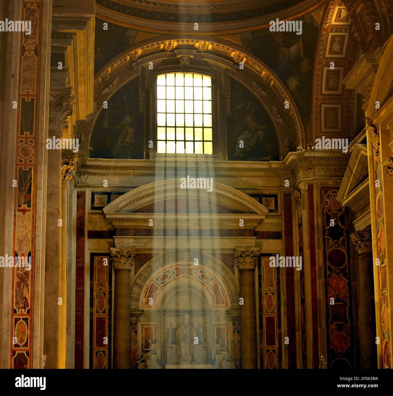 Light Streaming from the Sky trough a Window in Saint Peter Basilica in Vatican Stock Photo