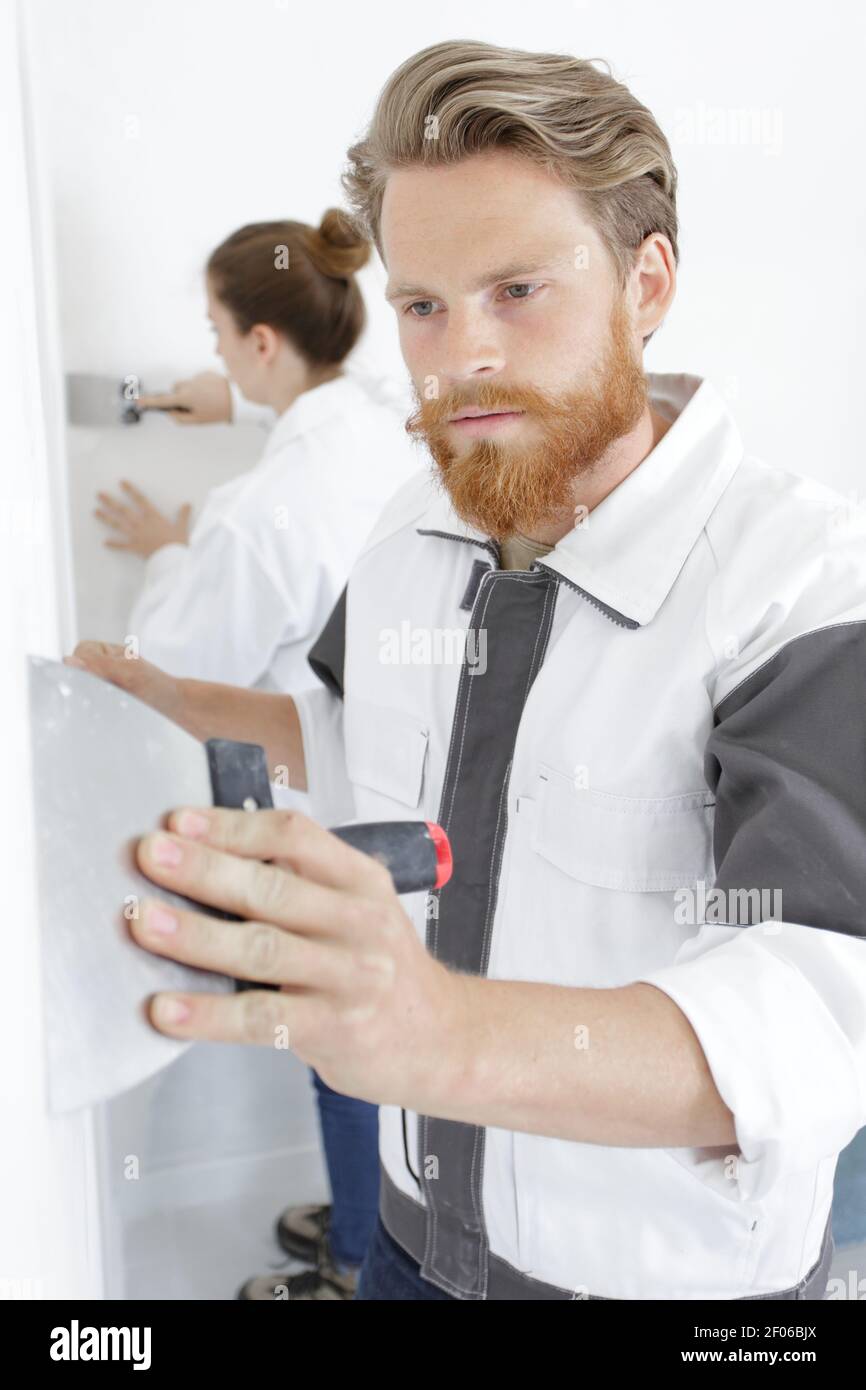 male worker with a spatula in his hand Stock Photo