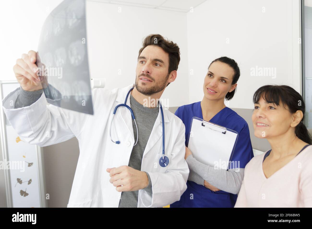 Doctor reading studying xray hi-res stock photography and images - Alamy