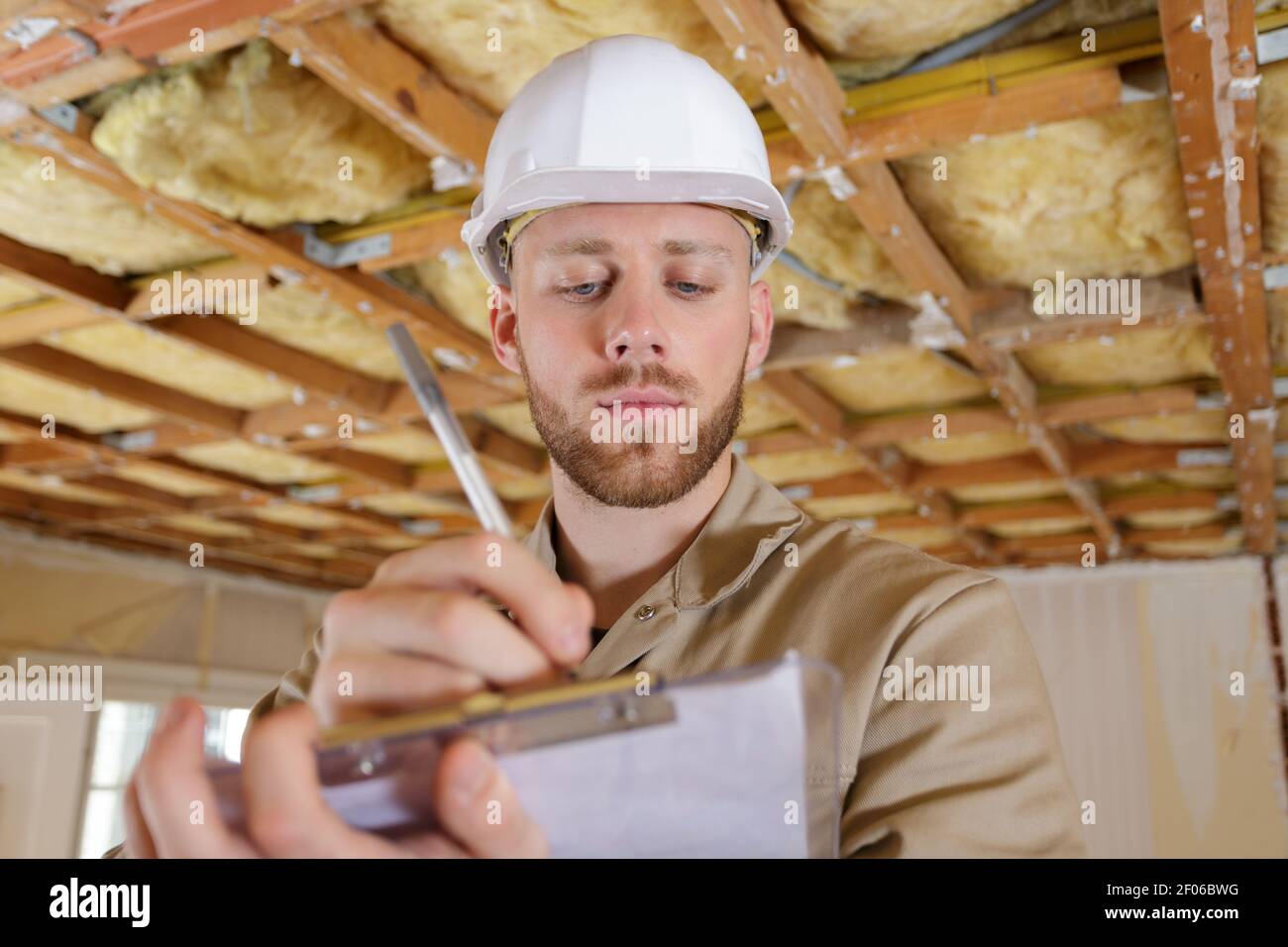 building inspector looking at new property Stock Photo Alamy