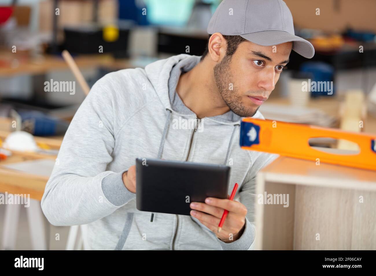 Handsome man using ruler in hi-res stock photography and images - Alamy