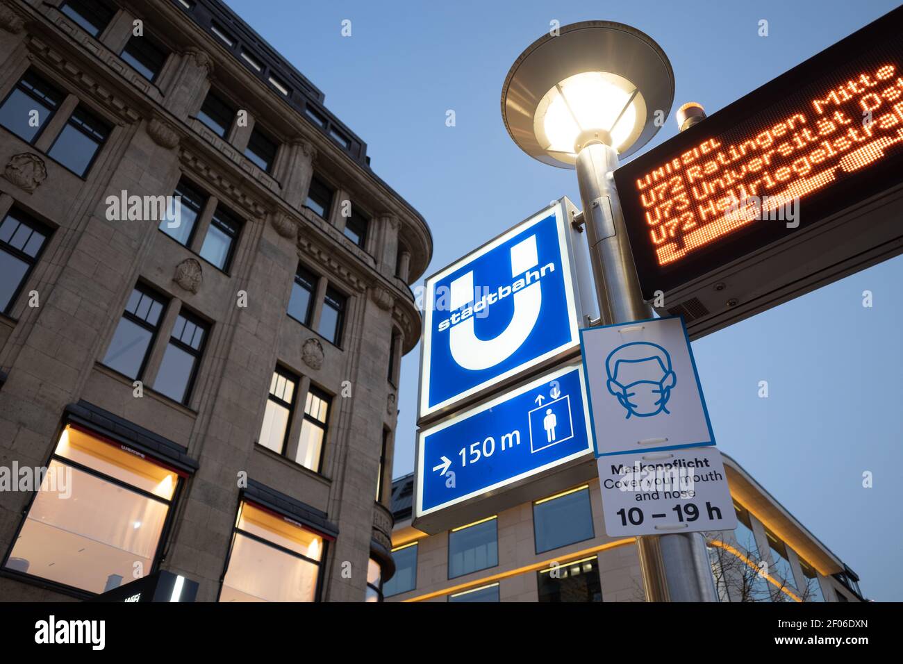 Selective focus and low angle view at protective face mask signage under  ubahn sign at entrance to underground metro train station in Düsseldorf,  Germ Stock Photo - Alamy