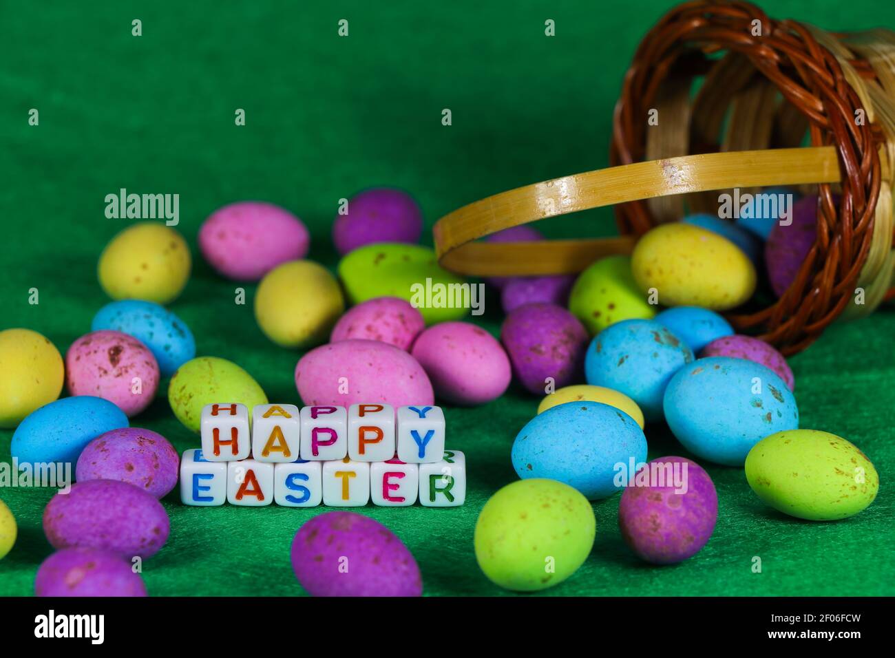 Happy Easter Colorful Spilled Woven Egg Basket Stock Photo