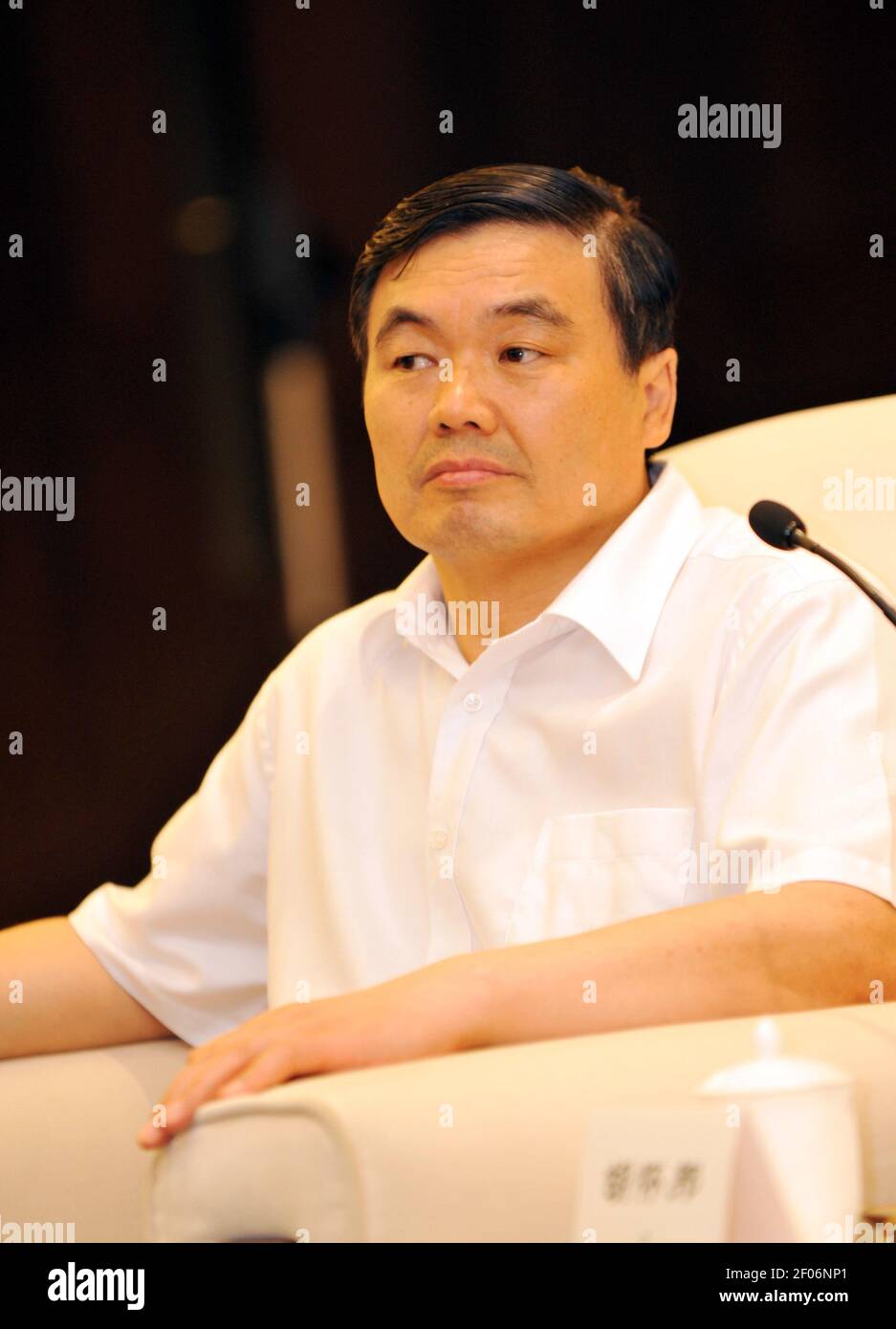 Hu Huaibang, the former chairman of Bank of Communications, shows up in Xiamen city, southeast China's Fujian province, 10 June 2011. Hu Huaibang, the former chairman of policy lender China Development Bank (CDB) linked to a secretive business tycoon, is now under investigation, in the latest case of China¡¯s years-long campaign against corruption in the financial sector. (Photo by Xiang Yang - Imaginechina/Sipa USA) Stock Photo
