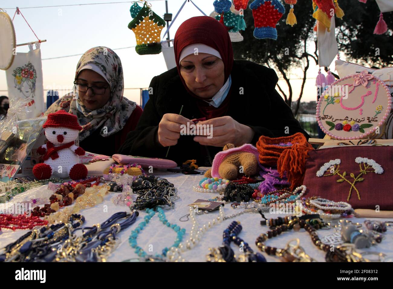 Gaza. 6th Mar, 2021. Palestinian women make their handicrafts at a handicraft exhibition in Gaza City, on March 6, 2021. Credit: Rizek Abdeljawad/Xinhua/Alamy Live News Stock Photo
