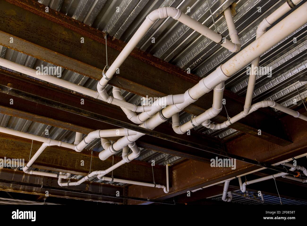 Plumbing roughin in commercial building with pvc pipe Stock Photo Alamy