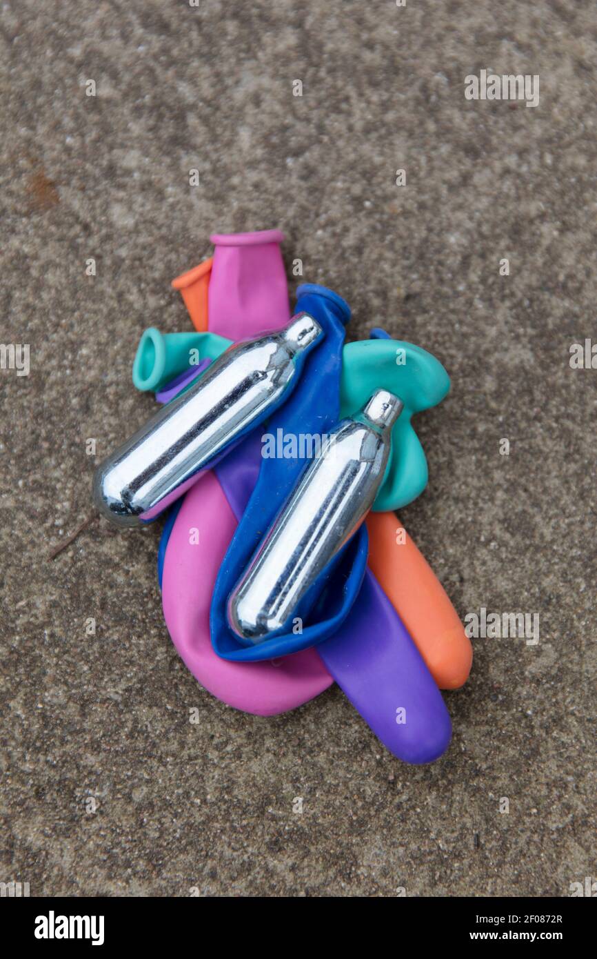 Nitrous oxide metal bulbs or laughing gas recreational drug use Stock