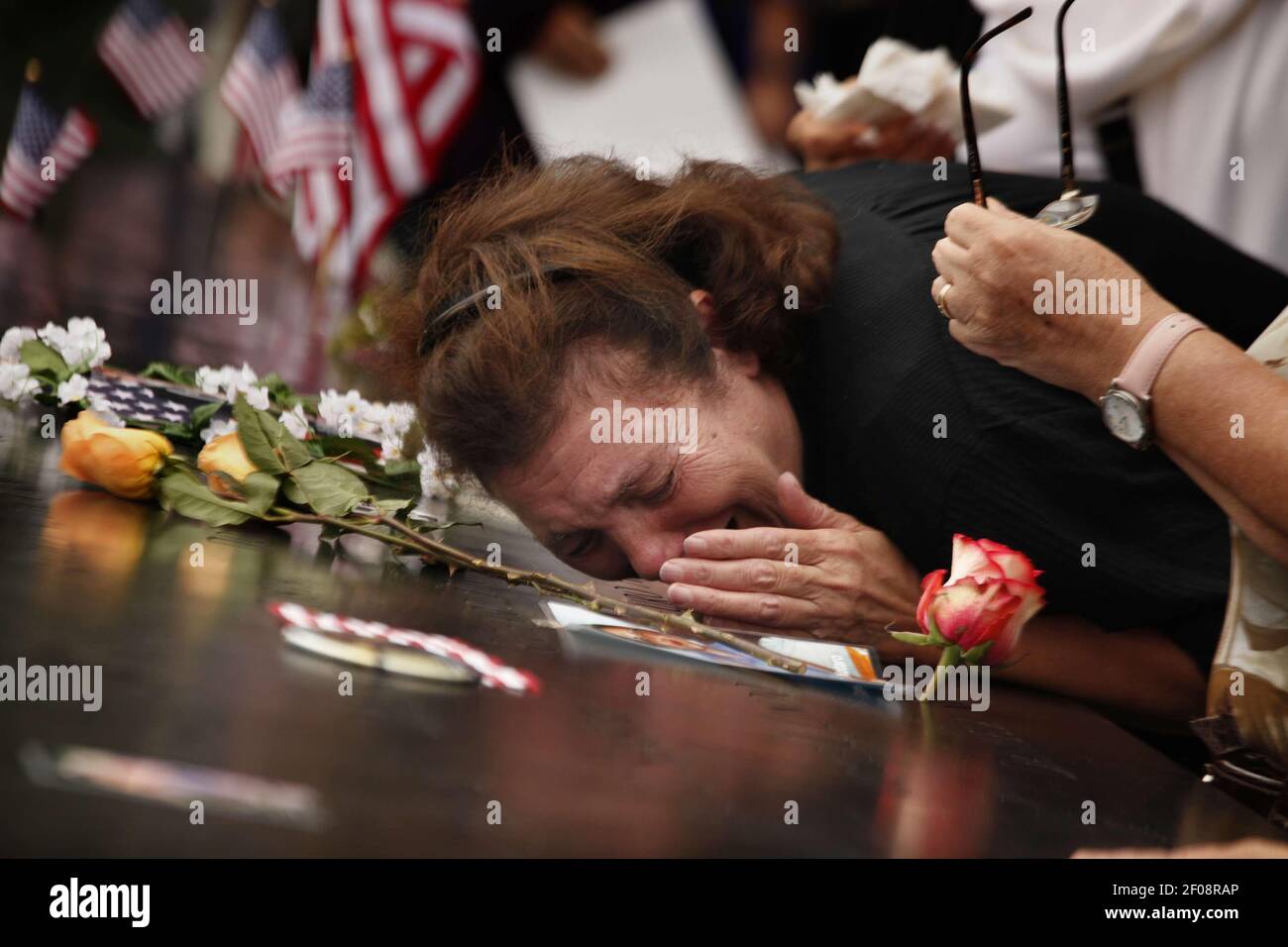 11 September 2011 - New York, NY - A woman mourns the loss of her son ...