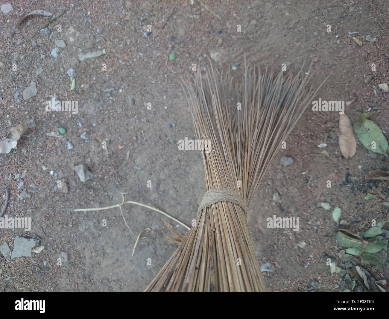Cleaning with Coconut Leaf Grass Broom on the ground Stock Photo Alamy
