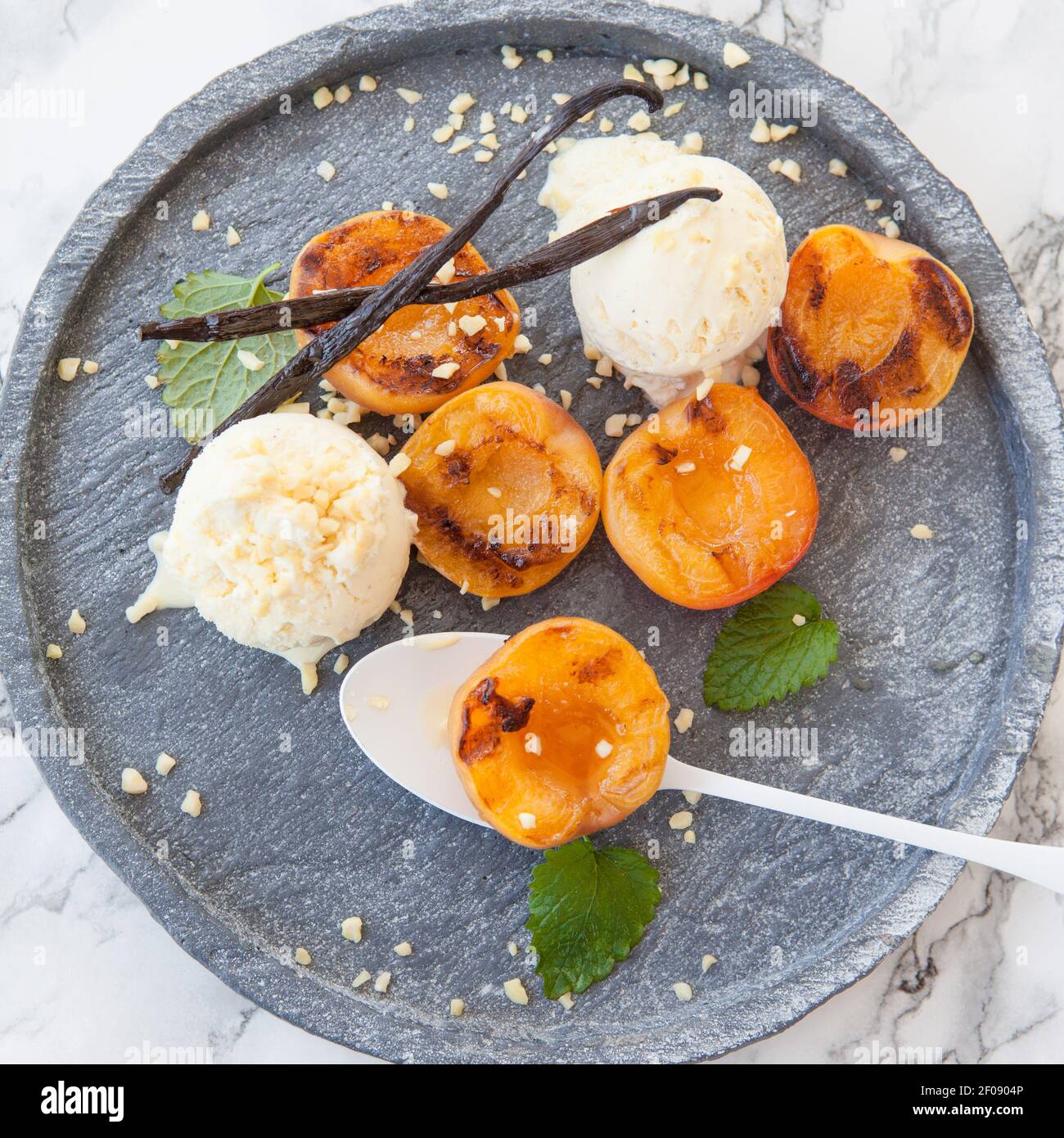 Grilled nectarines with ice cream Stock Photo Alamy