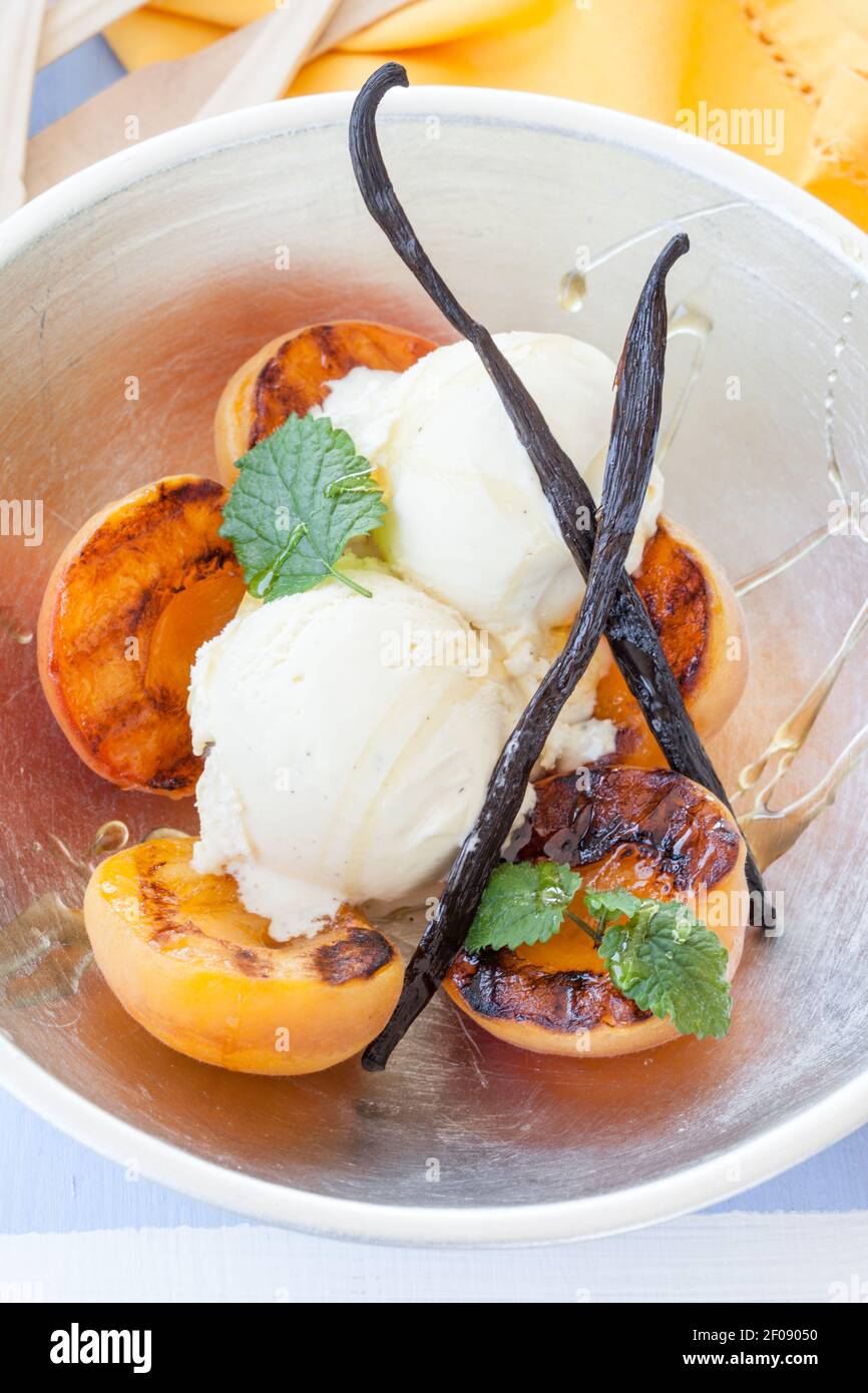 Grilled nectarines with ice cream Stock Photo Alamy