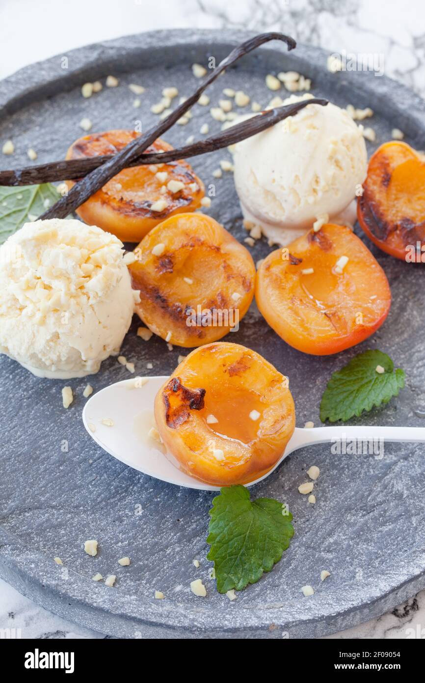 Grilled nectarines with ice cream Stock Photo Alamy