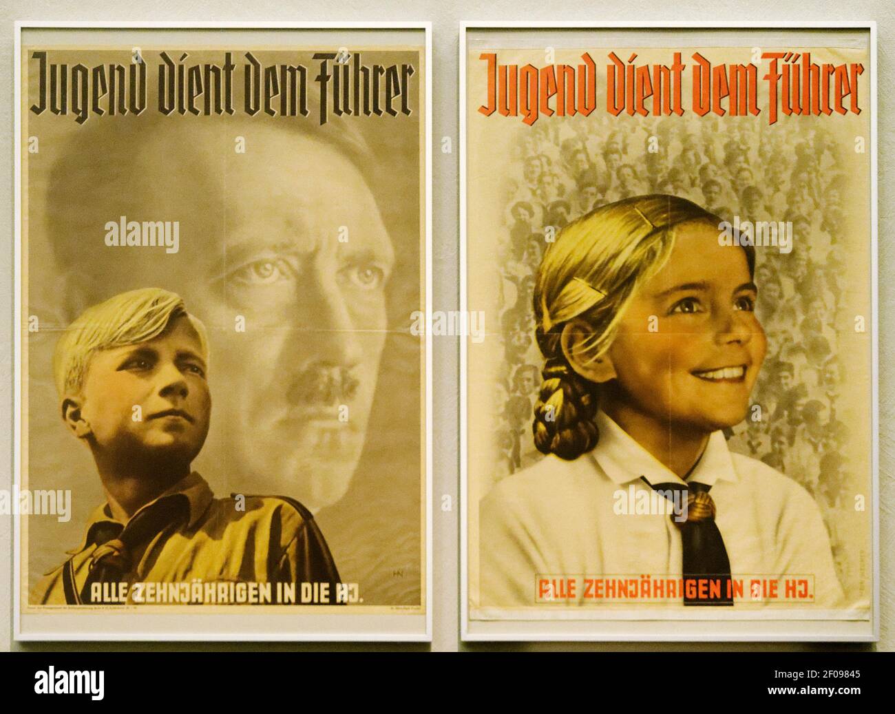 Nazi era posters for the Hitler Youth movement with the text Youth Serves The Fuhrer Stock Photo