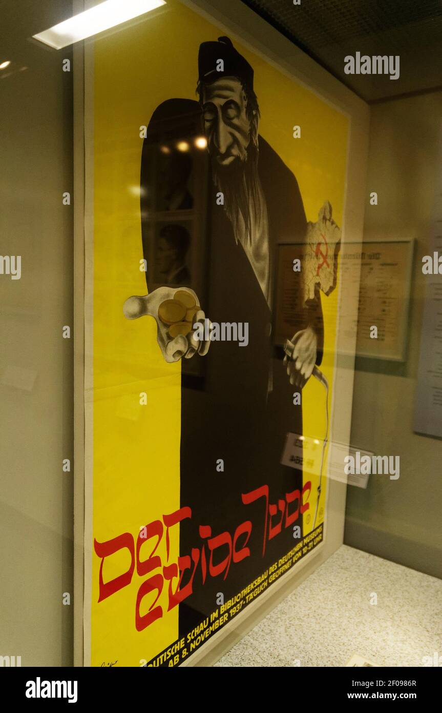 A nazi era poster featuring a caricature of a Jew with the text The Eternal Jew Stock Photo