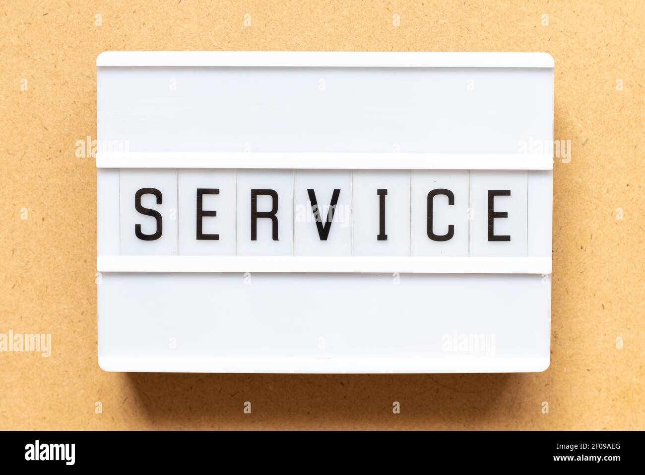 Lightbox with word service on wood background Stock Photo