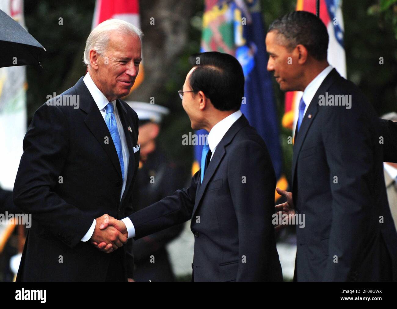 13 October 2011 - Washington, D.C. - U.S. Vice President Joe Biden greets South Korean President Lee Myung-bak as President Barack Obama watches during an arrival ceremony on the South Lawn at the White House in Washington, D.C. on October 13, 2011. Photo Credit: Kevin Dietsch/Pool/Sipa Press/1110141421 Stock Photo