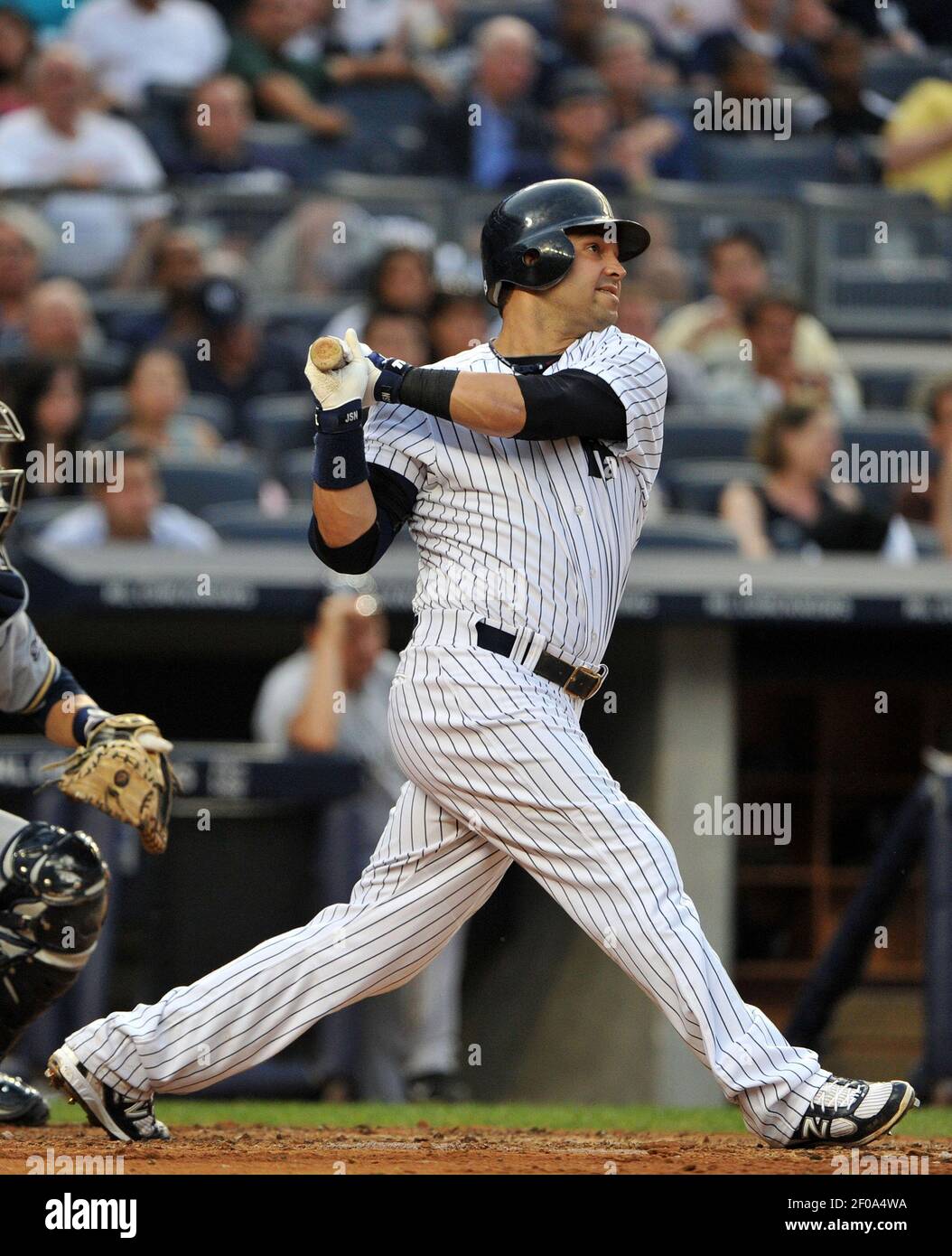 New York Yankees' Nick Swisher watches his three-run home run in the ...