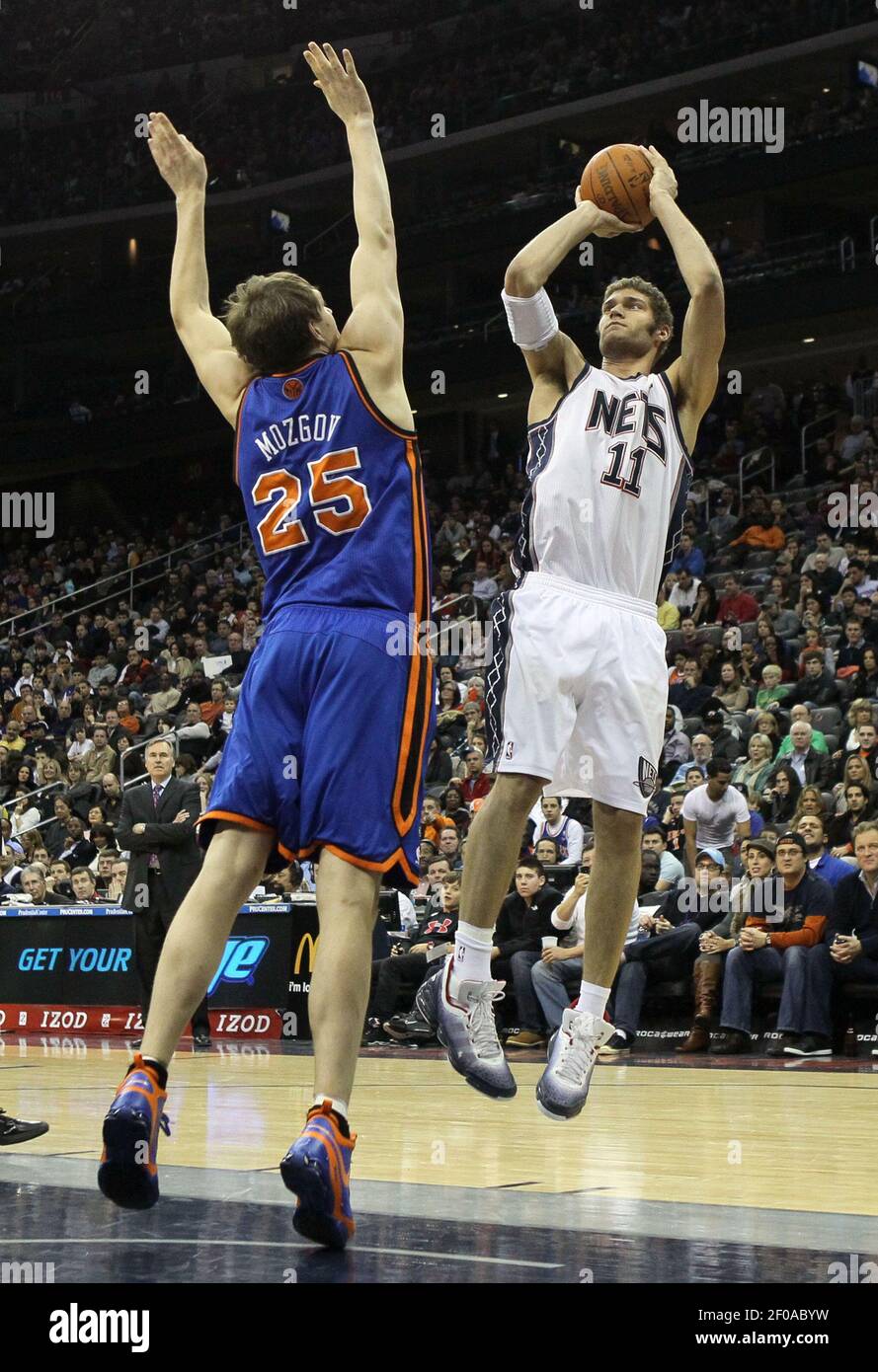 Brook Lopez (11) of the New Jersey Nets shoots against Timofey Mozgov (25)  of the New York Knicks at the Prudential Center in Newark, New Jersey, on  Saturday, February 12, 2011. The