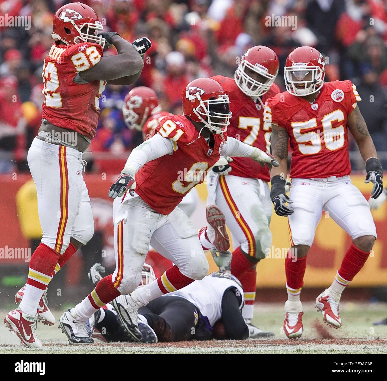Kansas City Chiefs linebacker Tamba Hali (91) celebrated with defensive end  Wallace Gilberry (92), defensive end Glenn Dorsey (72), and linebacker  Derrick Johnson (56) after sacking Baltimore Ravens quarterback Joe Flacco  in, image size:1300x1281