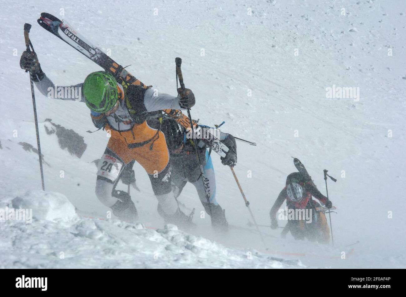 Competitors climb during the Five Peaks Ski Mountaineering Race in