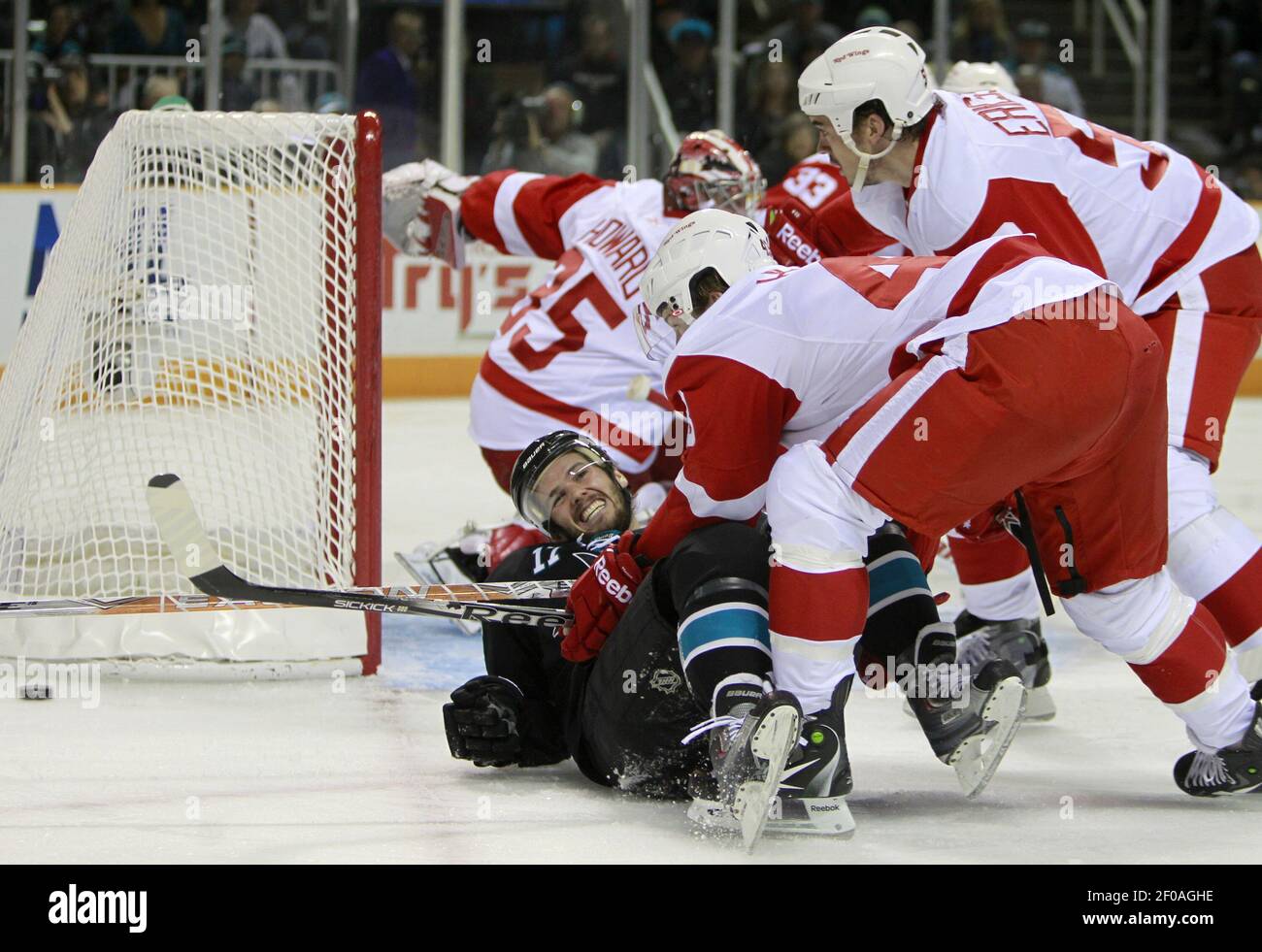 San Jose Sharks Torrey Mitchell (17) hits the ice while fighting for