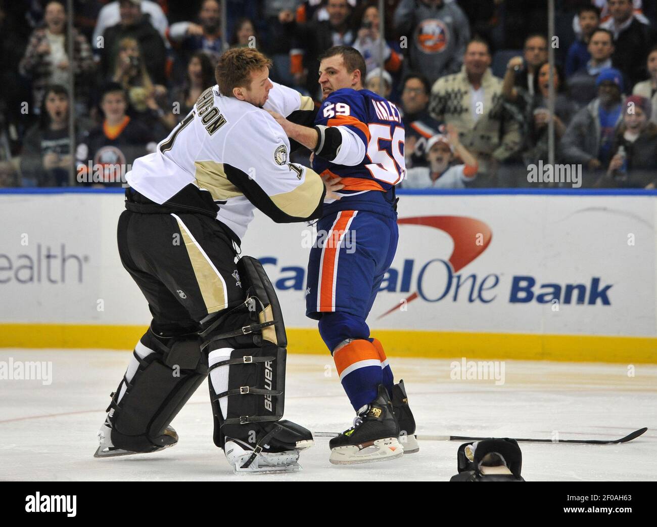 New York Islanders' Michael Haley, right, fights with Pittsburgh